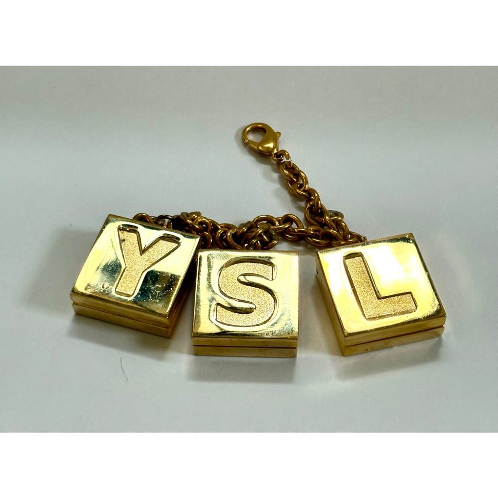 Vintage YSL Gold Purse Charm with 3 Mini Lipsticks – Rare Collector’s Edition